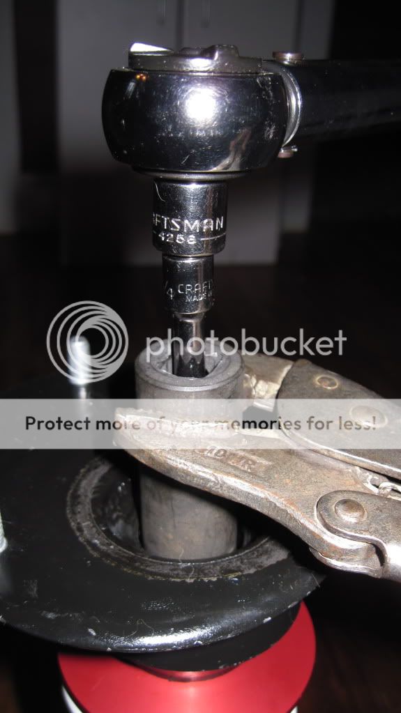 strut top nut tightening specs?